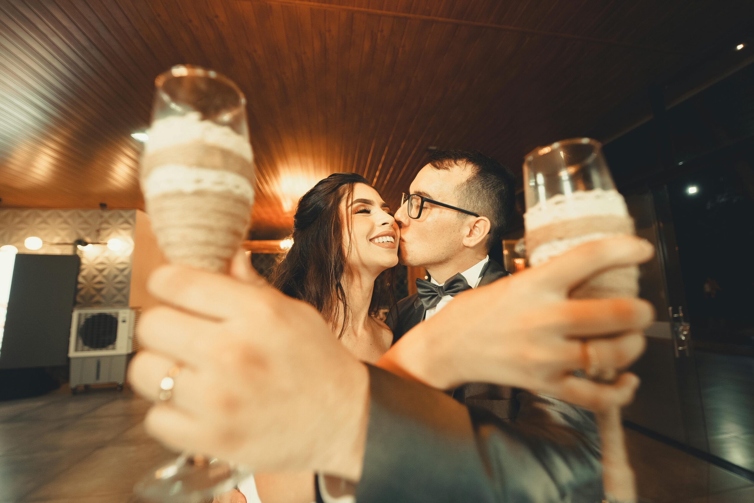 Bride and groom toasting with champagne at their wedding